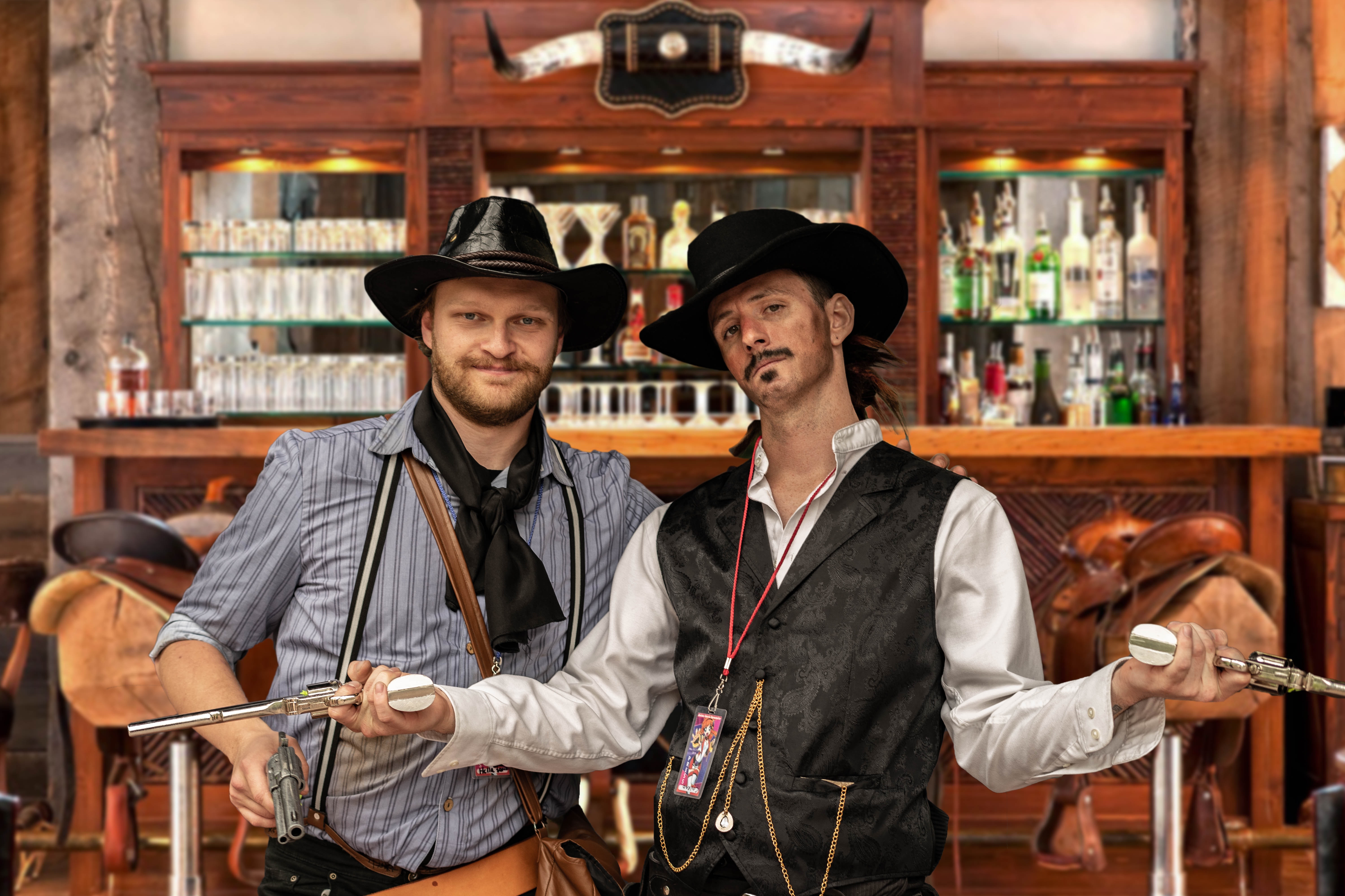 Two men in cowboy costume in a bar 