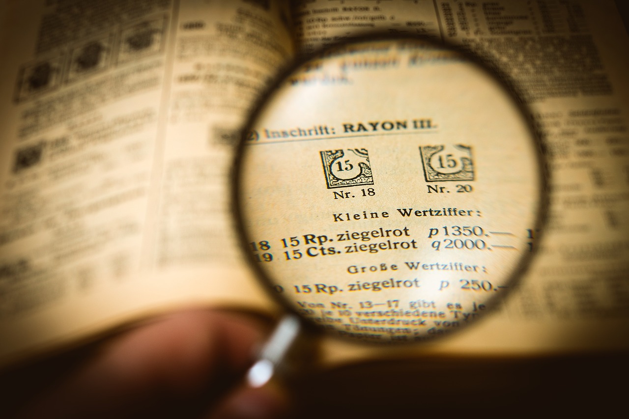 Old book under a magnifier