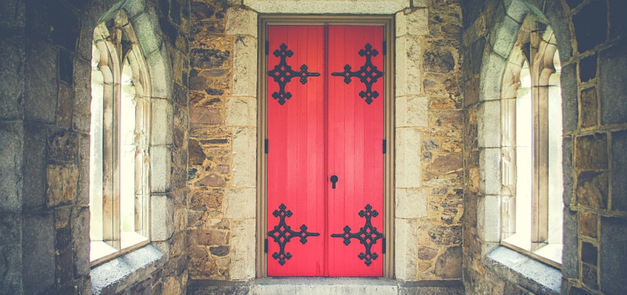 A red door in a castle – leading to who knows where
