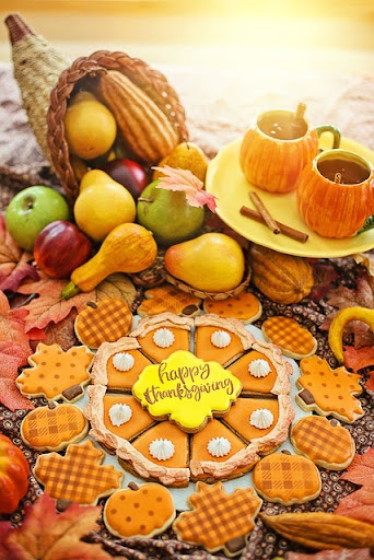 November Thanksgiving dishes: cakes, fruits, and tea on a table